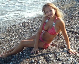 Cute blonde teen angel on the beach,
